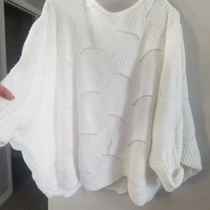 White oversized,  off the shoulder, stylish and cozy sweater.